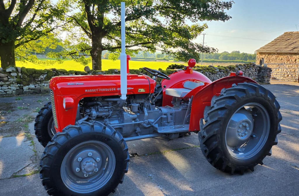 A red Massey Ferguson 35X Multi-Power tractor