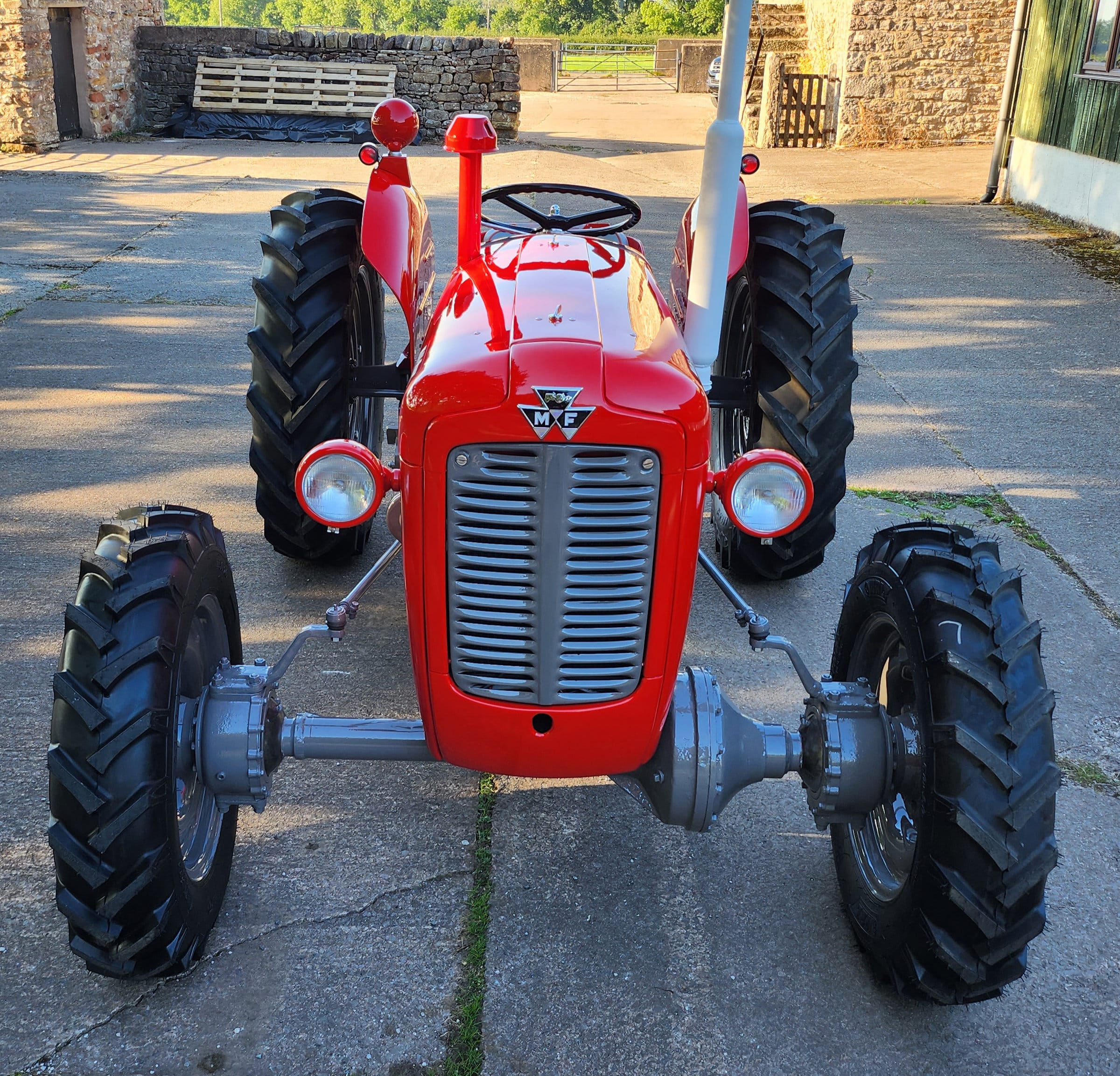 A red Massey Ferguson 35X Multi-Power tractor