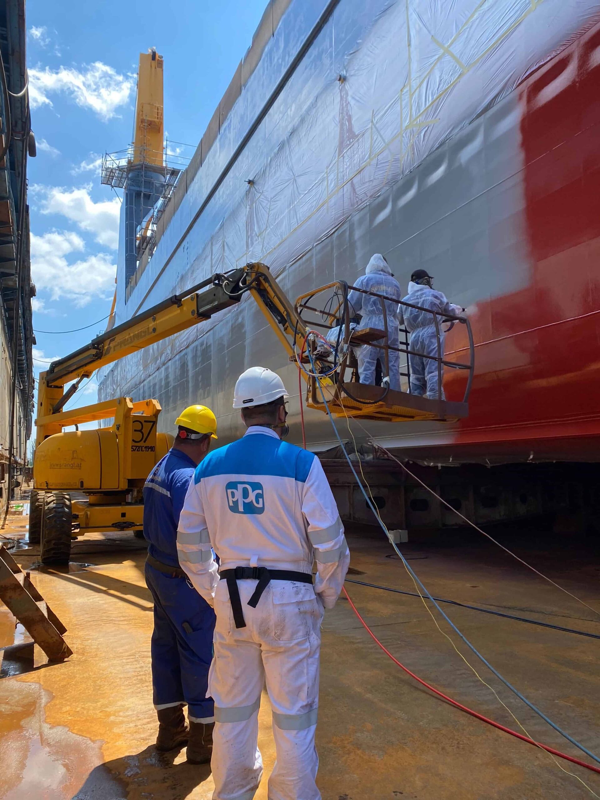 Trito Navigator being painted with PPG SigmaGlide 2390