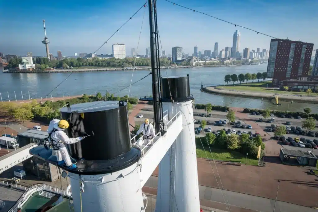 Painting the funnel on the SS Rotterdam 