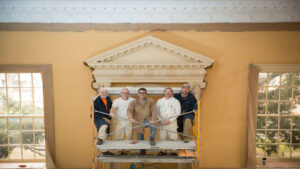 Canning painting the walls using 150mm-wide brushes at the Old Senate Chamber